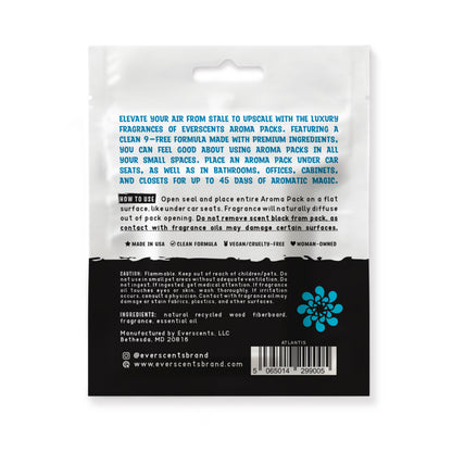 The back of the Everscents Aroma Pack pouch. The upper half is white, featuring an introductory product description printed in ocean blue text and usage instructions printed in black text. The lower half is black with white text, containing product warnings, ingredient list, manufacturer information, brand website, a barcode, and the brand logo, shown isolated on a white background