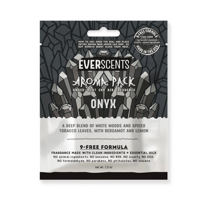 Everscents Aroma Pack under-seat car air freshener pouch. The upper half features an illustrated monochromatic grey crystal graphic on a charcoal grey geometric crystal outline background pattern with the brand text 'Everscents Aroma Pack' and the ‘Onyx’ scent name, while the lower white half displays a text description of the scent profile and product information, shown isolated on a white background.
